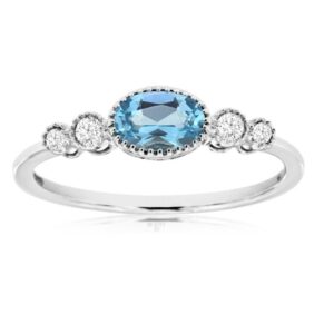 14kt white gold ring with blue topaz.and diamonds.