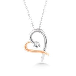 10 karat white and rose gold diamond heart pendant with 1/20 carat total weight of round brilliant diamonds.
